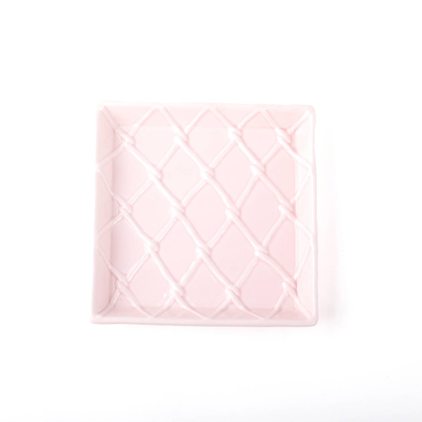 Square, light pink ceramic tray with a raised diamond pattern. Available sizes: beverage napkin tray.