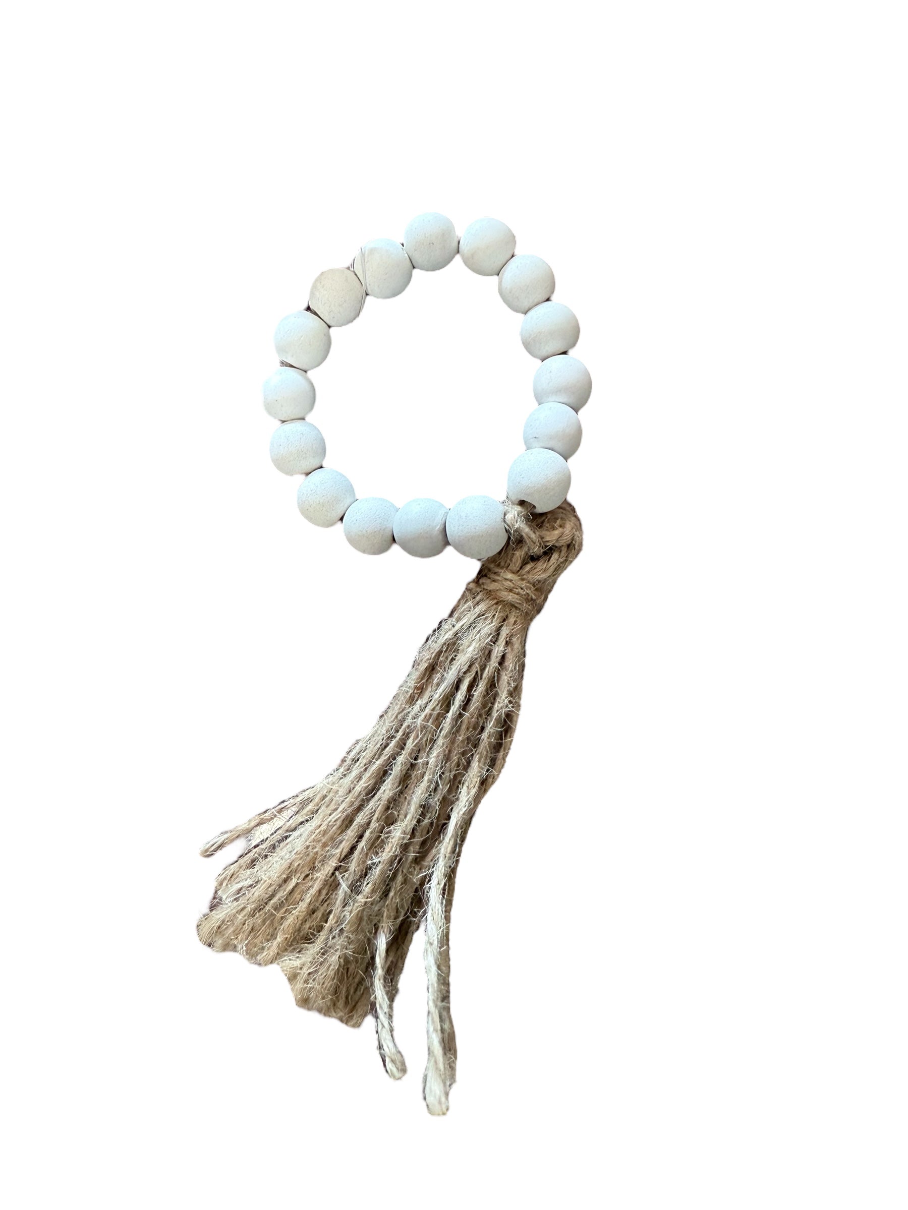 White beaded napkin ring with tan jute tassel, rustic farmhouse style. Sizes available: standard.