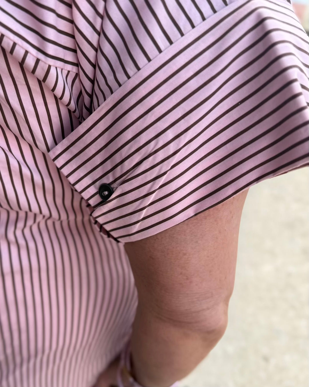Pink and brown striped polo midi dress with short sleeves and button cuffs. Available in multiple sizes.