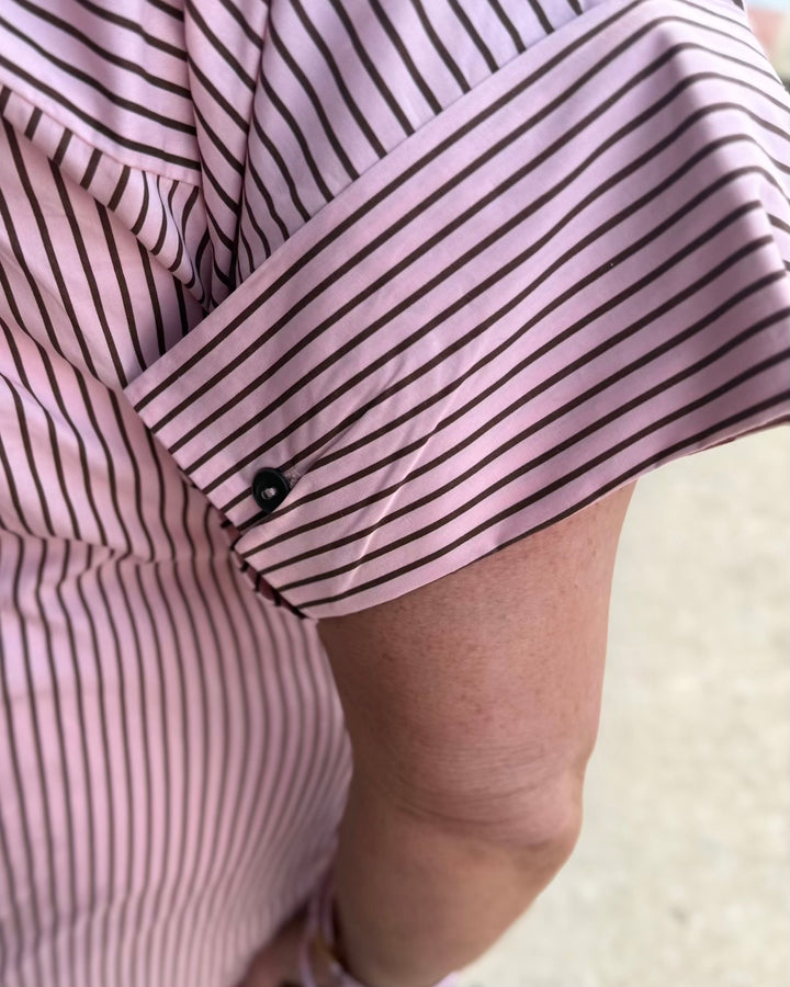 Pink and brown striped polo midi dress with short sleeves and button cuffs. Available in multiple sizes.