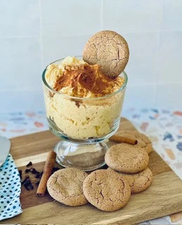 A glass bowl of creamy Carmie’s Pumpkin Spice Cheesecake Dip Mix, topped with cinnamon and a cookie. Available sizes: 8 oz, 16 oz.