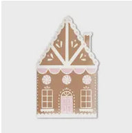 Gingerbread house-shaped holiday paper plates with white and pink icing details.