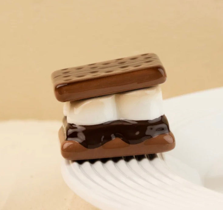 Nora Fleming Minis s'more with two marshmallows and chocolate between graham crackers; available in mini size.