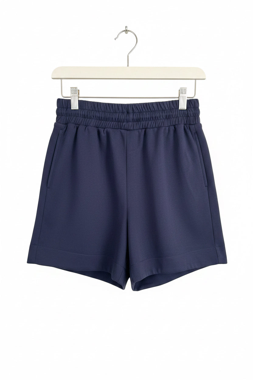 Dark navy blue buttery soft shorts with lightweight fabric and elastic waistband, available in sizes S–XL.