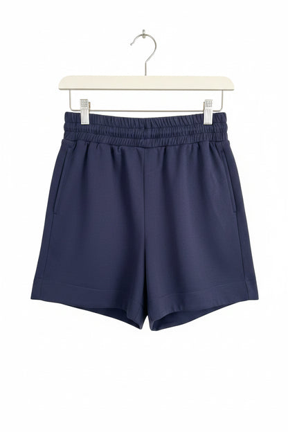 Dark navy blue buttery soft shorts with lightweight fabric and elastic waistband, available in sizes S–XL.