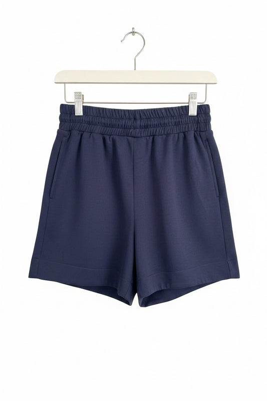 Dark navy blue buttery soft shorts with lightweight fabric and elastic waistband, available in sizes S–XL.