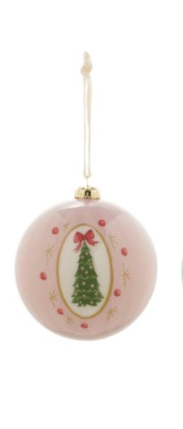 Pink Christmas ornament with gold cap, green Christmas tree illustration topped with red bow, red dots, and gold stars. Hangs from white string. Available in multiple sizes.
