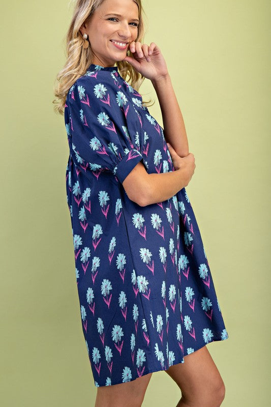 Midnight Floral Print Mini Dress in navy blue with light blue and pink flowers. Available in sizes XS-XL.