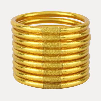 Set of 9 gold, textured, waterproof All Weather Bangles® by BuDhaGirl. Available in multiple sizes.
