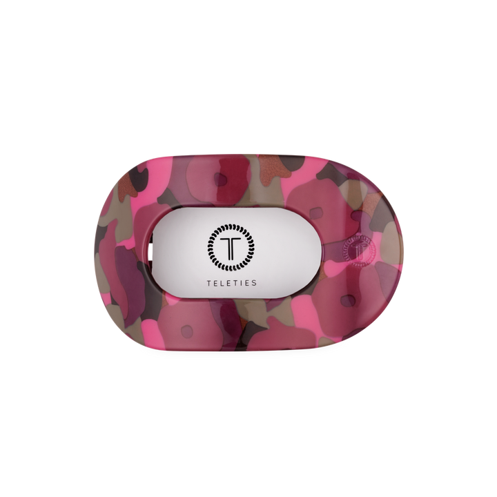 Garden Glam Medium Flat Round Hair Clip with a pink, brown, and purple camouflage pattern in an oval shape, flat back, and TELETIES logo in the center. Available in medium size.