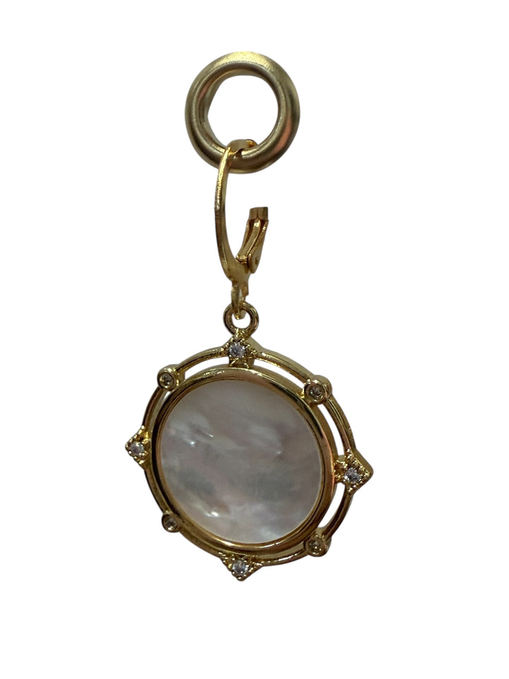 Gold pendant with round iridescent mother-of-pearl center and diamond accents. Available in 16", 18", and 20" sizes.