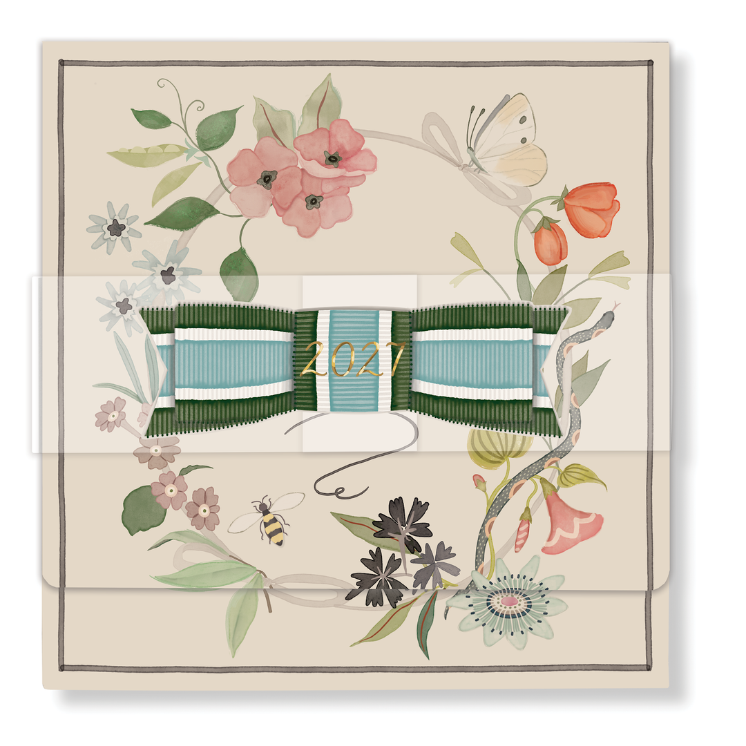 2027 Classic Desk Calendar Refill featuring a square hand-glittered floral wreath and a striped green and blue ribbon.