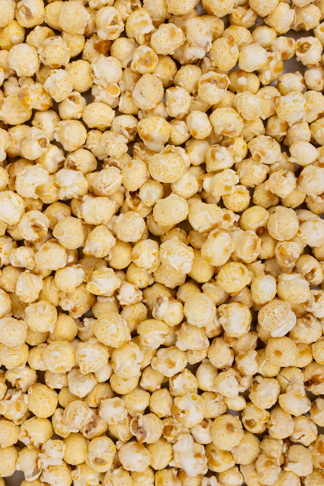 Funnel Cake Popcorn: yellow, buttered kernels with powdered sugar coating. Available in small, medium, and large sizes.