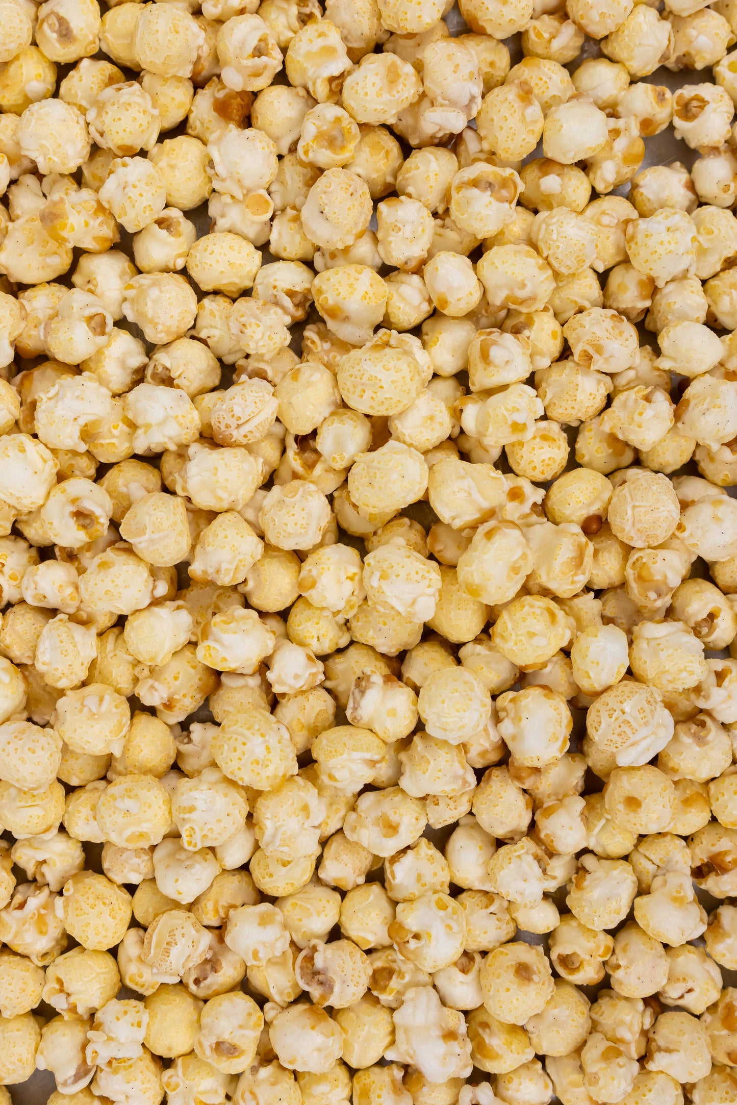 Funnel Cake Popcorn: yellow, buttered kernels with powdered sugar coating. Available in small, medium, and large sizes.