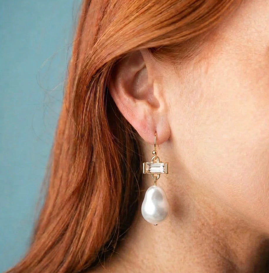 Pearl Drop Earrings: gold drop earrings with a rectangular gemstone and a teardrop-shaped pearl. Available in small, medium, and large sizes.