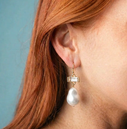 Pearl Drop Earrings: gold drop earrings with a rectangular gemstone and a teardrop-shaped pearl. Available in small, medium, and large sizes.