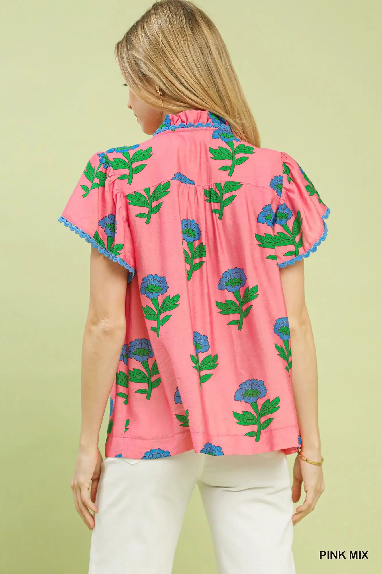 Pink floral button front ruffle sleeve top with blue and green floral print, blue lace trim on sleeves. Available in sizes XS-XL.