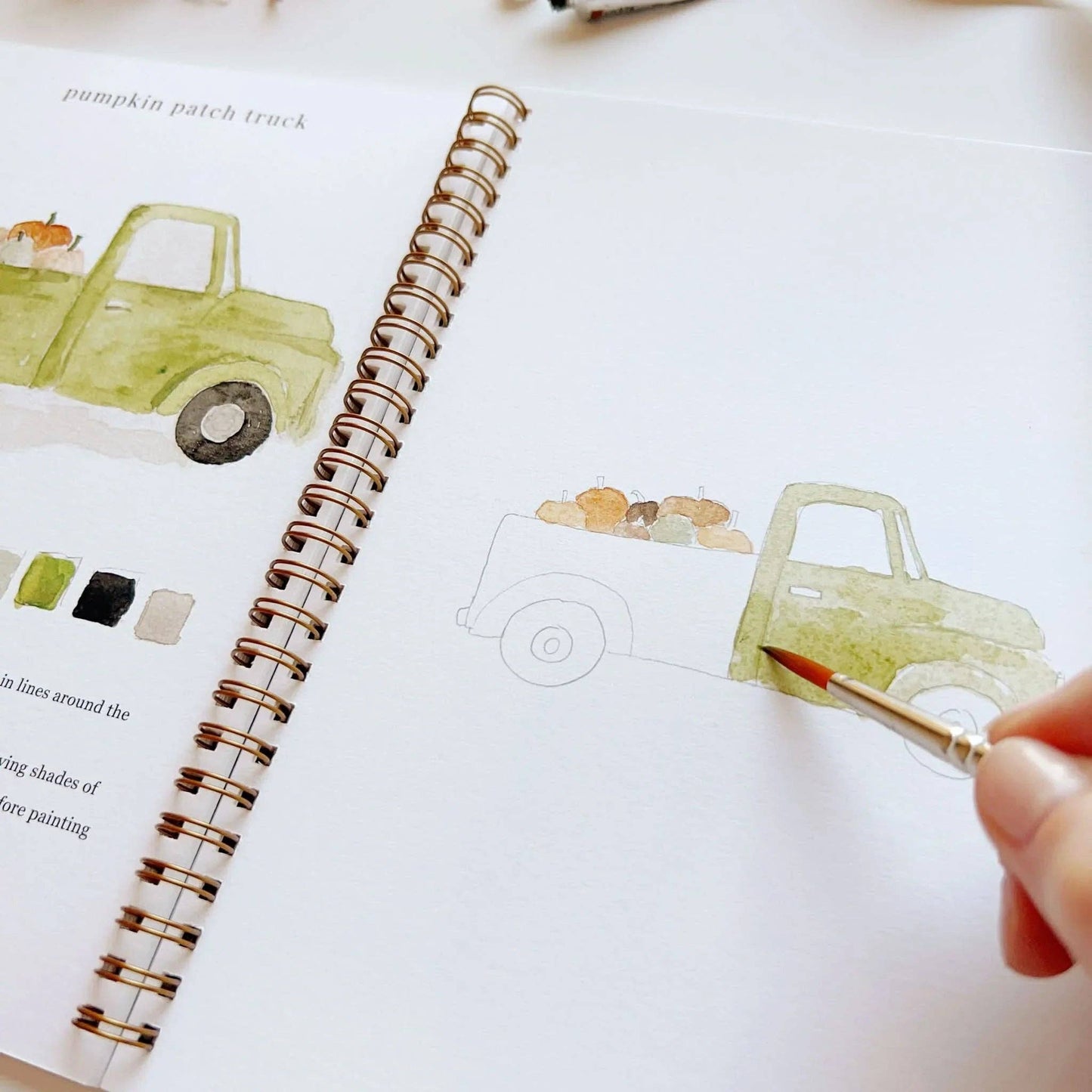 Autumn watercolor workbook with a hand-painted green pickup and pumpkins. Spiral-bound. Available in A4 and A5 sizes.