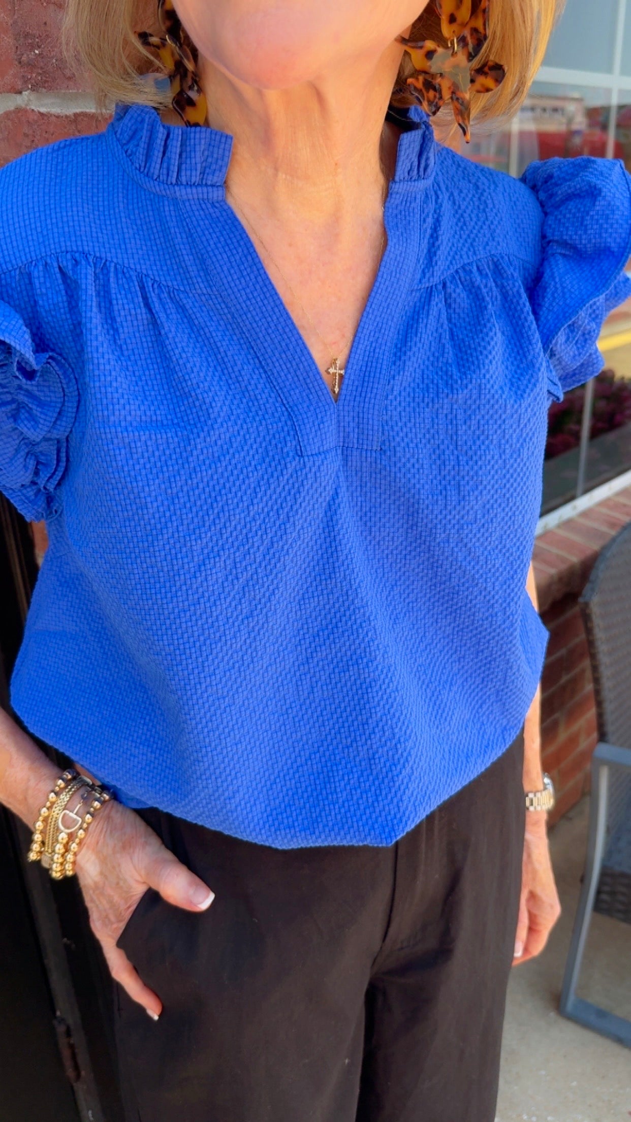 Ocean Breeze Ruffle Sleeve Top in ocean blue, textured with ruffled sleeves. Available in sizes XS-XL.