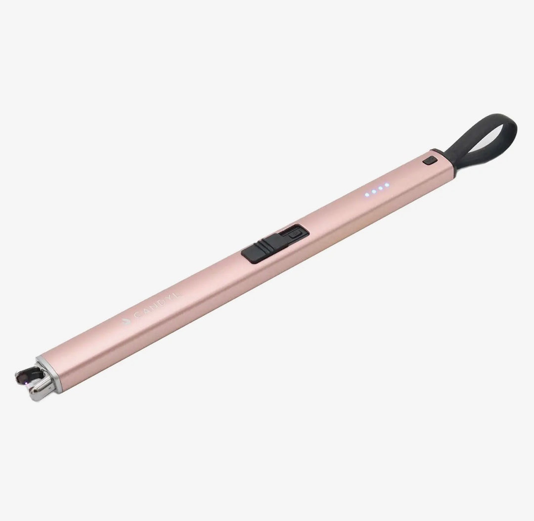 Slim rose gold rechargeable Electric Candle Lighter with black loop, power switch, LED indicator lights, and exposed ignition tip. Available sizes: standard.