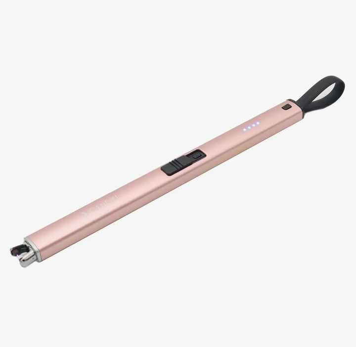 Slim rose gold rechargeable Electric Candle Lighter with black loop, power switch, LED indicator lights, and exposed ignition tip. Available sizes: standard.