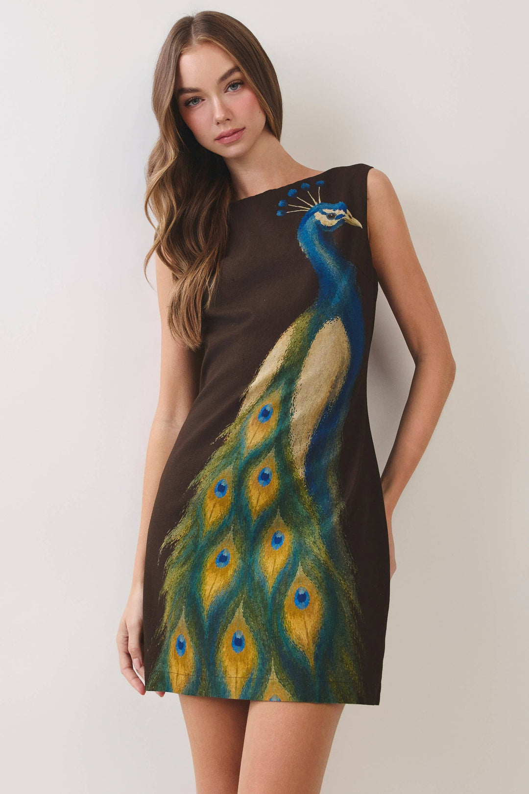 CD07499-Peacock Print Mini Dress in CHOCOLATE, size L; sleeveless mini dress featuring a bold peacock design and fitted silhouette. Sizes available: L.