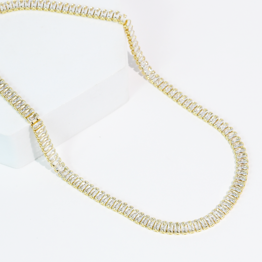The Royale Necklace: gold chain, rectangular clear gemstones, crystal accents. Available in 16", 18", and 20" lengths.