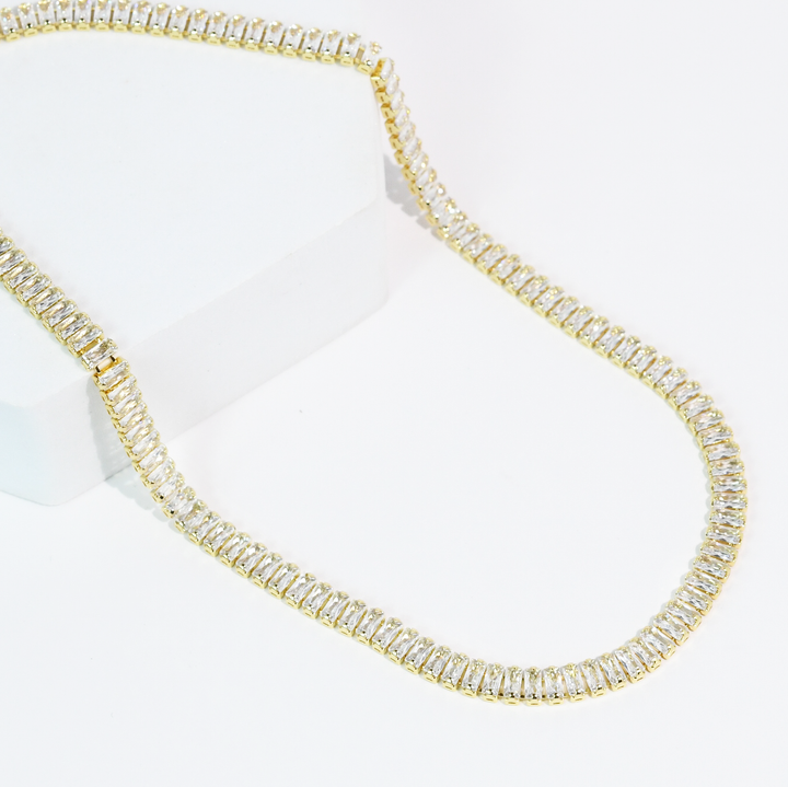 The Royale Necklace: gold chain, rectangular clear gemstones, crystal accents. Available in 16", 18", and 20" lengths.