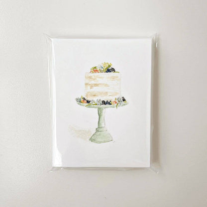 Set of 8 white notecards with watercolor fruit-topped cake on green stand. Sizes: standard note card.