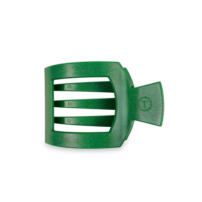 TELETIES Square Flat Hair Clip in glittery green plastic with a black background and three horizontal slots. Side tab has a circular design for secure styling. Available sizes: small, medium, large.