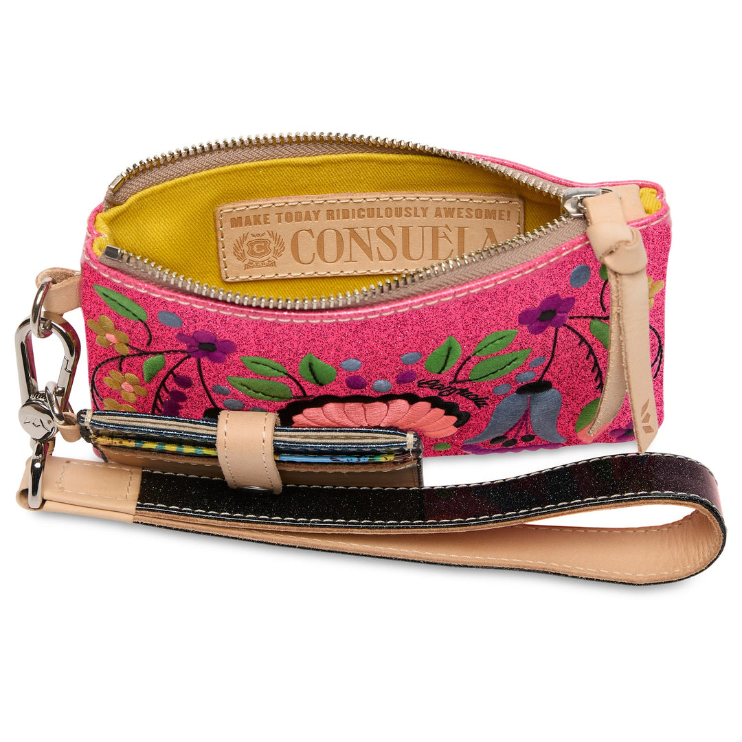 Small pink embroidered wristlet wallet with floral designs, yellow interior, beige label, leather card strap. Available in one size.