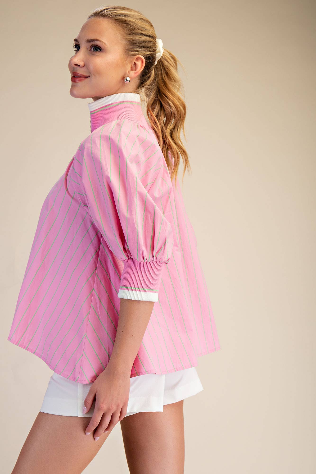 Pink Mock Neck Band Puff Sleeve Blouse. Available in sizes XS-XL.