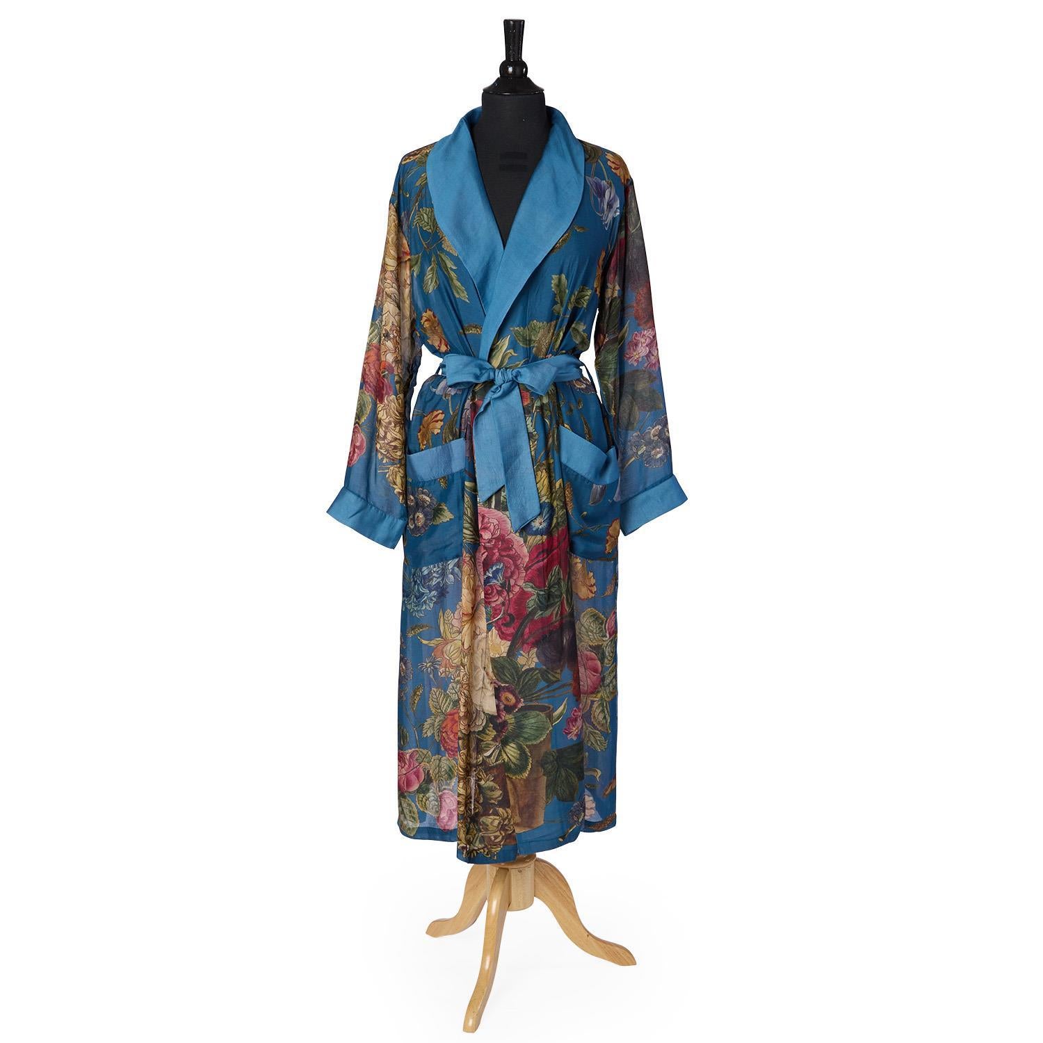 Primula Print Teal Robe in sheer modal-cupro, floral pattern, blue collar, belt, cuffs, two pockets; below-knee. Sizes XS-XL.