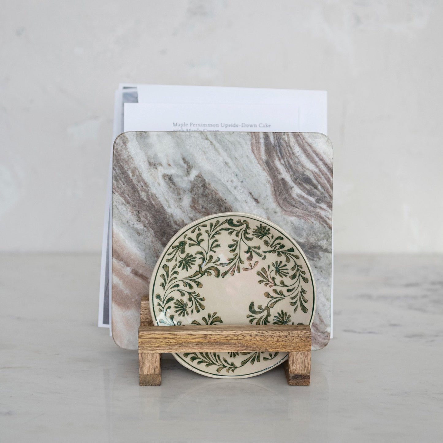 Small green and white decorative plate with leafy pattern on a 3-section Mango Wood Stand. Sizes: small, medium, large.