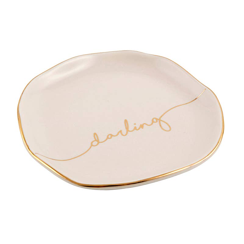 Cream ceramic tray, irregular shape, gold rim, “darling” in gold cursive. Available size: 5x4 inches.