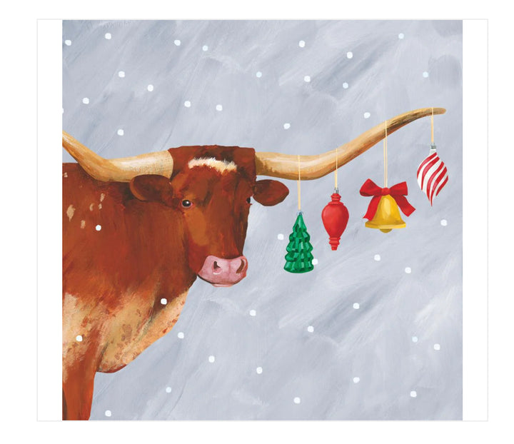 Holiday napkins featuring a longhorn cow with four Christmas ornaments on 3-ply paper.