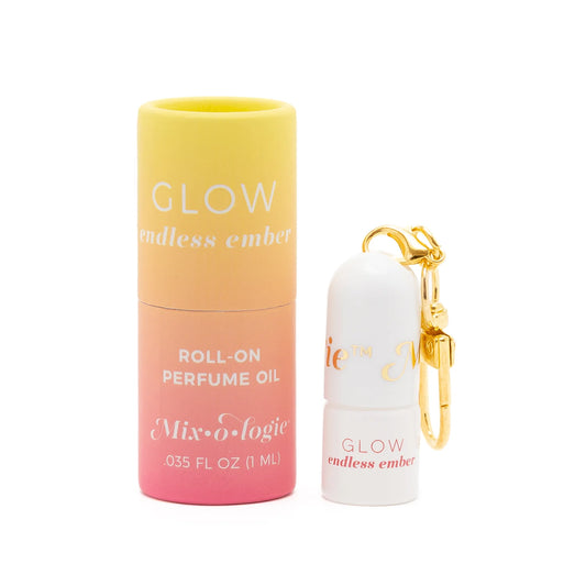 Small cylindrical keychain mini rollerball perfume labeled "Glow endless ember," available in 0.3 oz size.