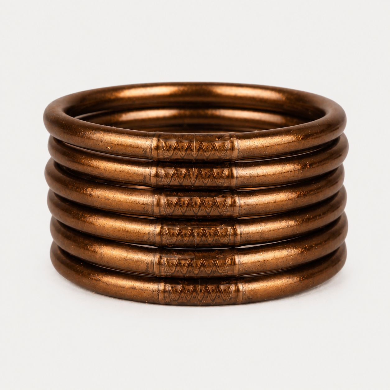 Six Saddle All Weather Bangles with engraved side patterns, available in multiple sizes.
