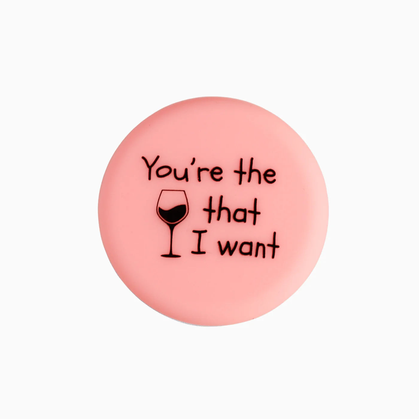 Pink circular wine bottle stopper with "You're the [wine glass] that I want" text. Sizes available: standard bottle fit.