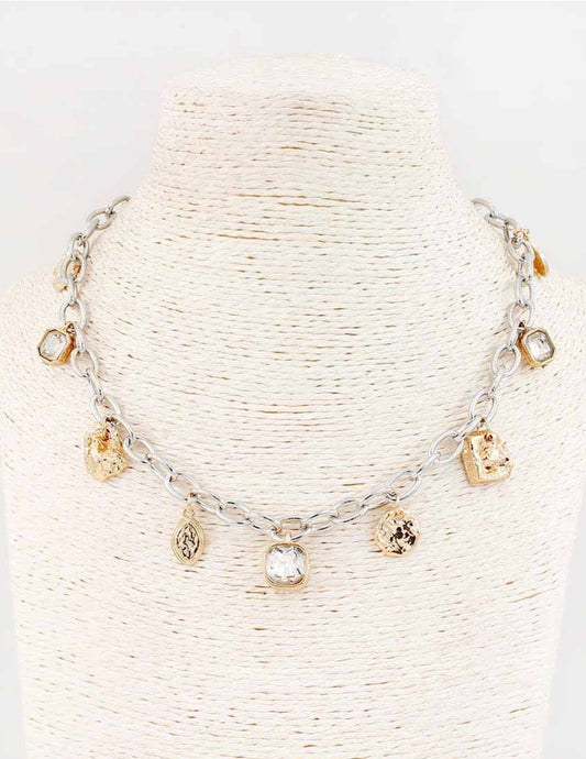 The Brim Gold Silver Necklace features irregular gold and silver charms on a chain-link design. Available in 16" and 18".