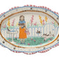 Oval ceramic platter with scalloped edges, colorful decorative borders; available in 12" and 16" sizes.