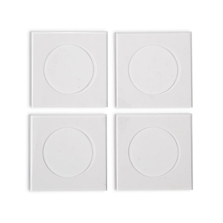 Four clear square customizable acrylic coasters with circular indented centers.