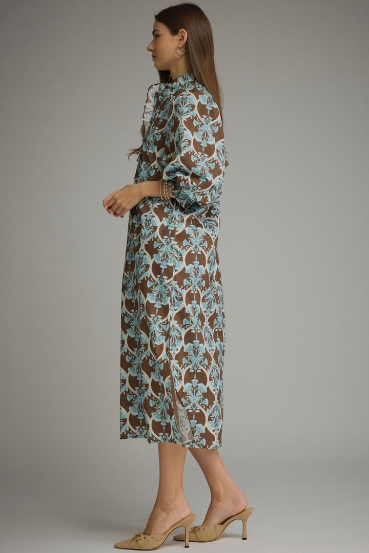Lena Ruffle Midi Dress in a brown and light blue floral pattern with a ruffle collar and long, puff sleeves. Available in all sizes.