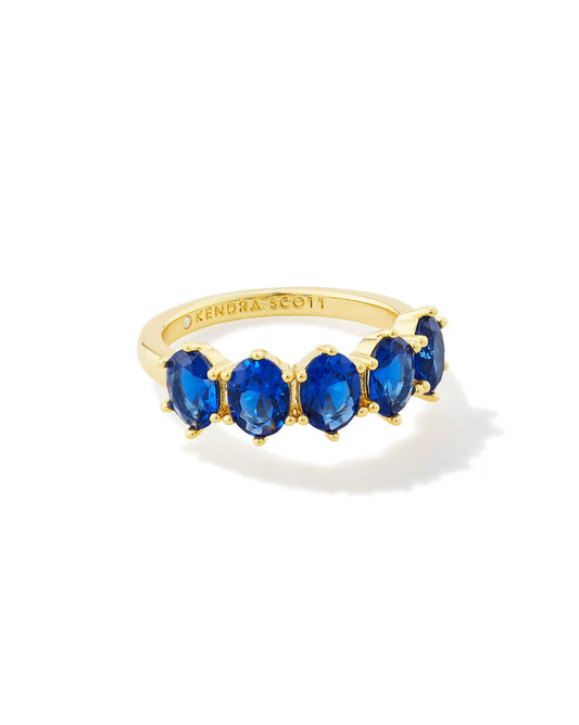 Gold ring with five oval cobalt blue stones in a row, "KENDRA SCOTT" inside. Available in multiple sizes.