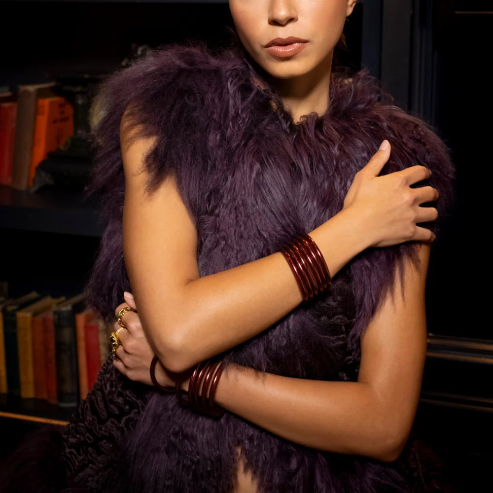 Merlot All Weather Bangles shown stacked on wrists; available in small, medium, and large sizes.
