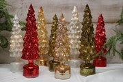 Eight illuminated, spinning, musical glass Christmas trees in red, gold, green, and clear.