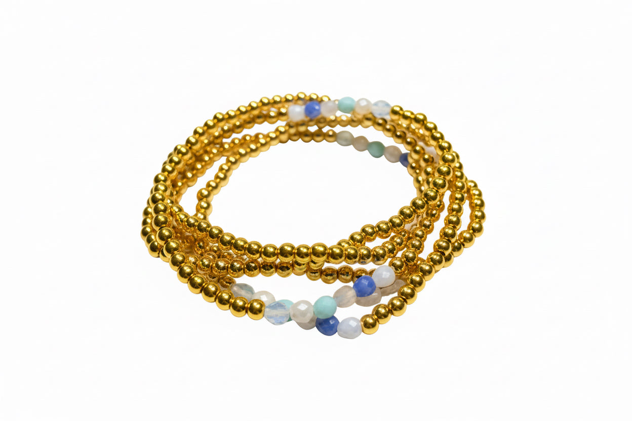 Multi Gold Strand Water Resistant Stretch Bracelet with small gold, blue, green, and white beads in coils. Sizes: S/M, M/L.