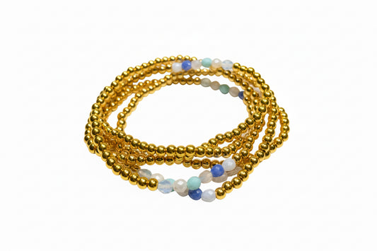 Multi Gold Strand Water Resistant Stretch Bracelet with small gold, blue, green, and white beads in coils. Sizes: S/M, M/L.