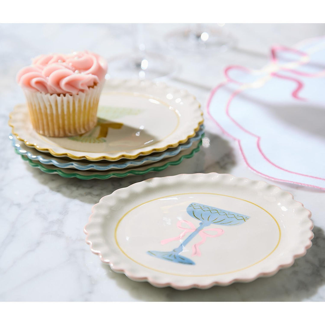 Stack of four Cheers Tidbit Plates with scalloped edges and colorful champagne glass illustrations.