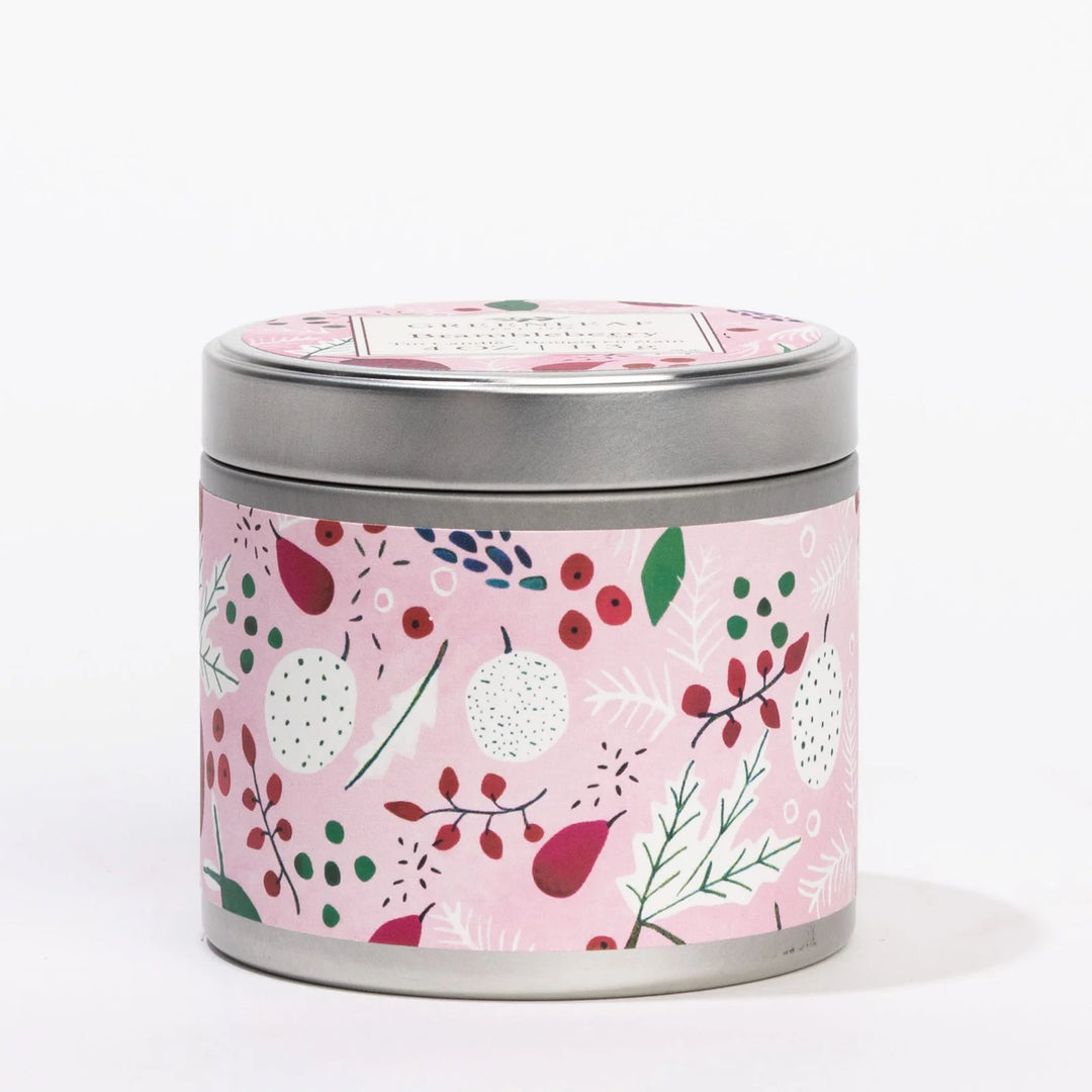 Brambleberry 4oz candle in a hand-painted metal tin with a berry and leaf patterned pink wrap.